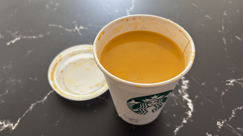 Starbucks pumpkin spice latte with lid removed from cup