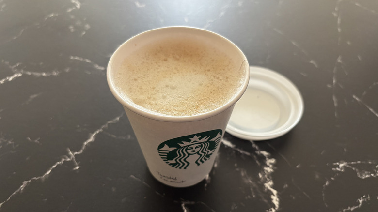 Starbucks toasted coconut latte with lid removed from cup