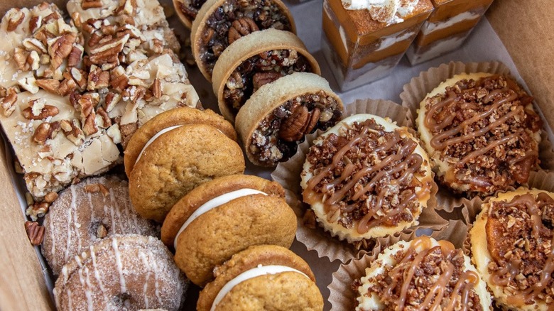 Box of assorted basked gookd including mini pecan pies and cream pies