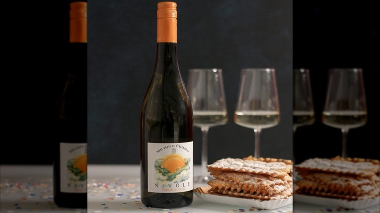 bottle and glasses of wine with dessert
