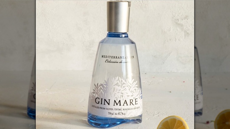 bottle of gin mare with a lemon