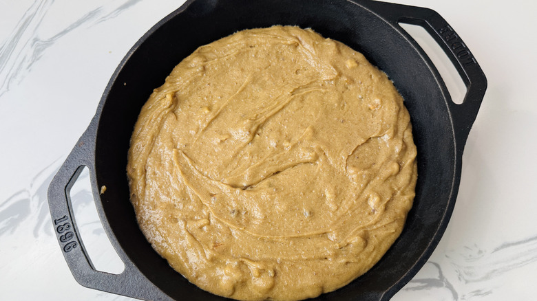 Blondie batter spread out in skillet