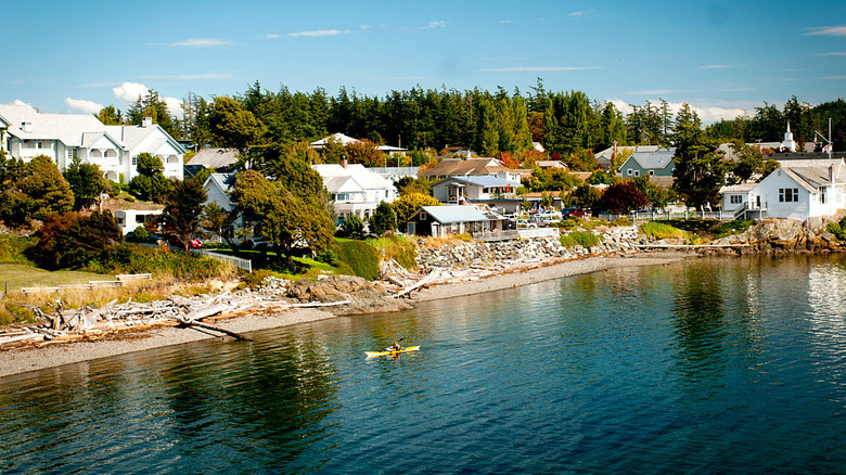 Eastsound on Orcas Island along the Salish Sea with a kayaker in the water