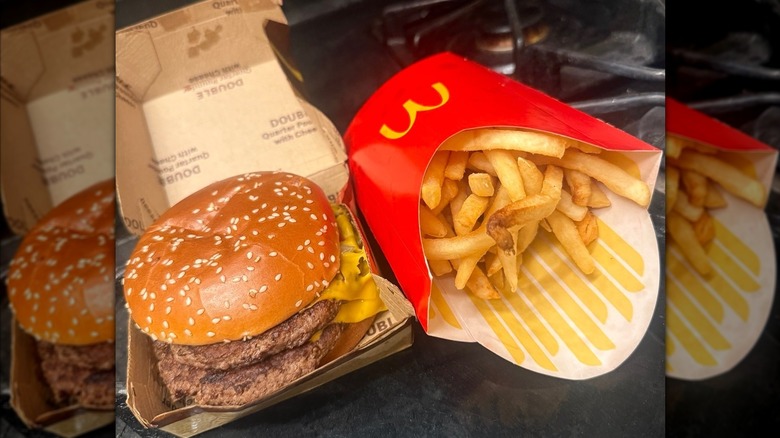 McDonald's Double Quarter Pounder with Cheese and fries on home stove