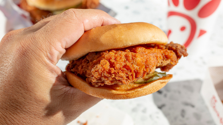 Chick-fil-A chicken sandwich held in hand