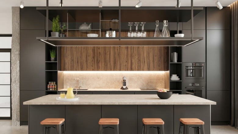 A kitchen featuring mostly black and brown elements