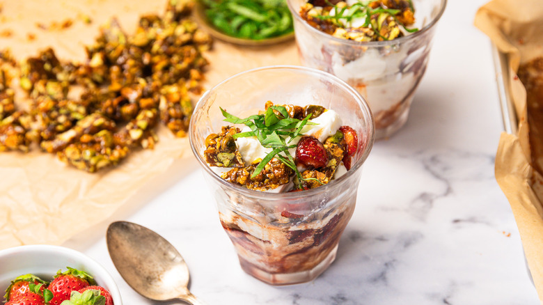 Strawberry Balsamic Sundae on table with pistachio brittle in background