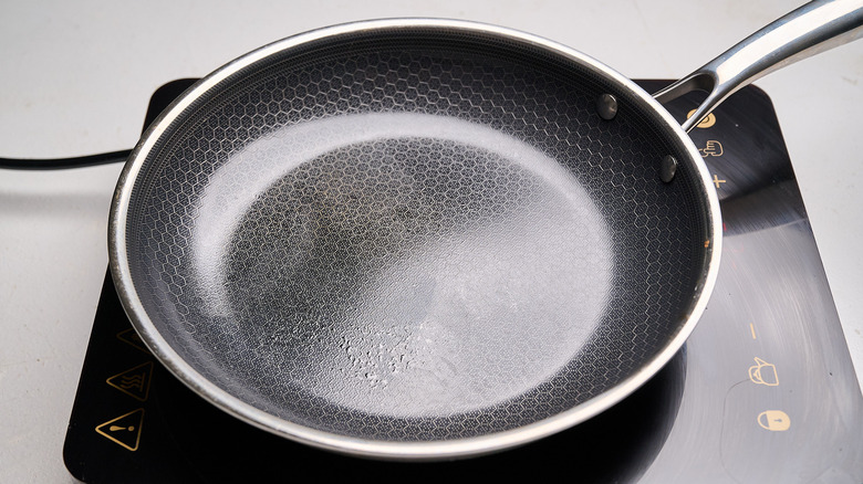 heating a skillet on a stove