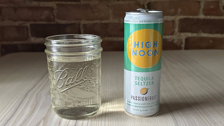 Passionfruit High Noon on table with glass