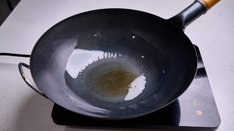 heating oil in a wok