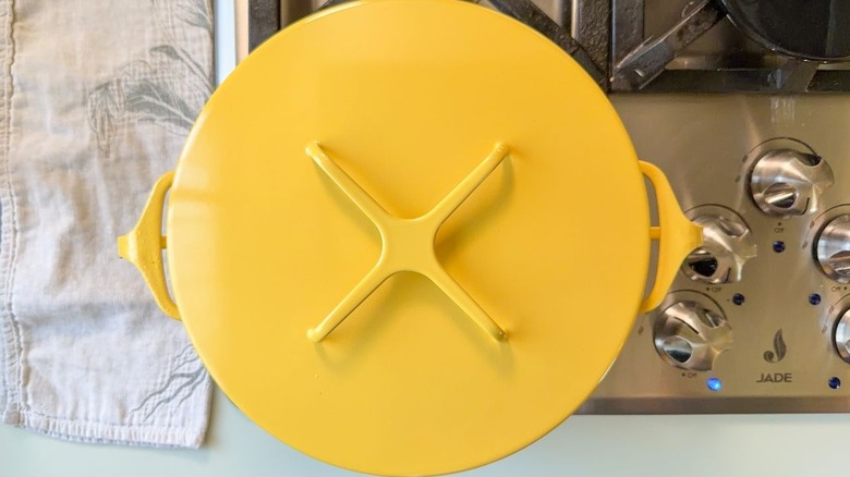 Covered yellow pot on stovetop
