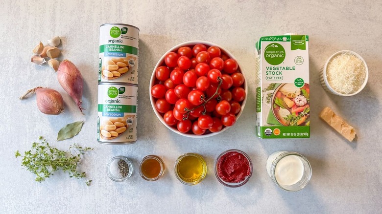 Ultra-creamy white bean tomato soup ingredients on countertop