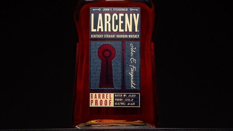 A close up shot of a bottle of Larceny Barrel Proof in front of a black background
