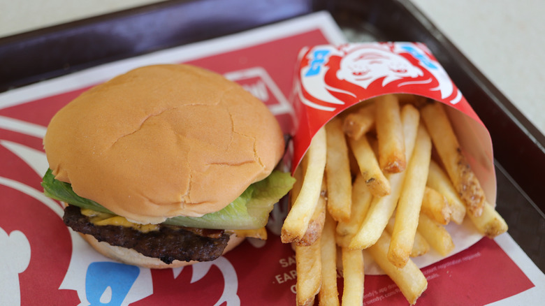 A Wendy's burger meal with a square patty