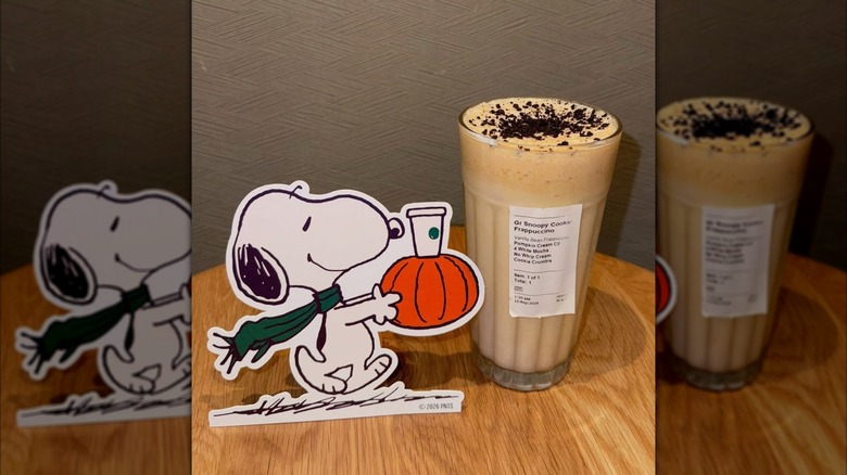 Starbucks Snoopy Cookie Frappuccino in glass with Peanuts Snoopy cutout