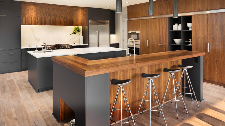 Dark wood kitchen with charcoal gray accents.