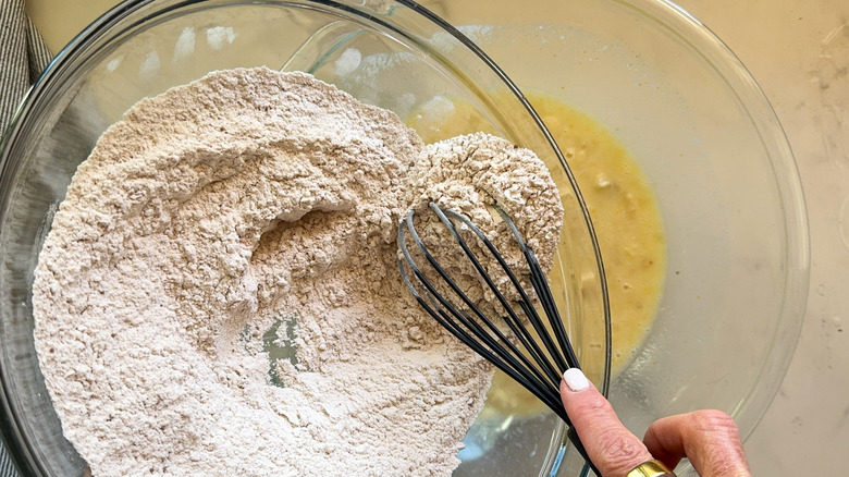 dry ingredients getting poured into wet