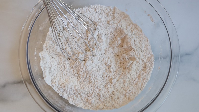 Flour mixture with whisk in bowl