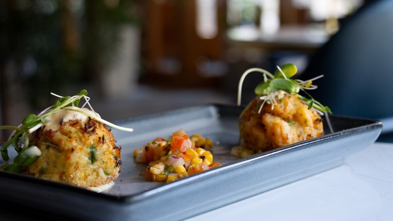 Crab cakes and salsa on tray