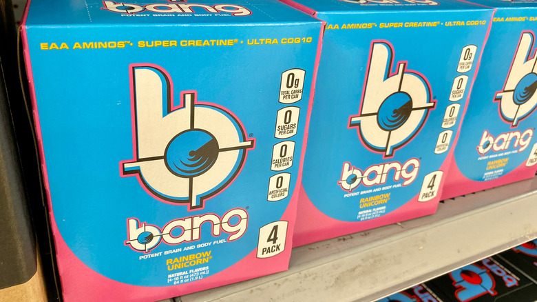 Cases of Bang energy drink sitting on a store shelf.