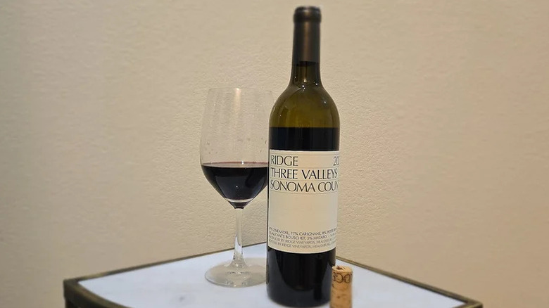 Bottle of Ridge Vineyards Three Valleys Red Blend on small white table