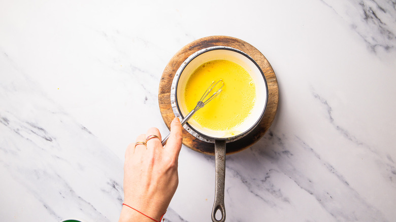 Whisking egg yolks with other ingredients